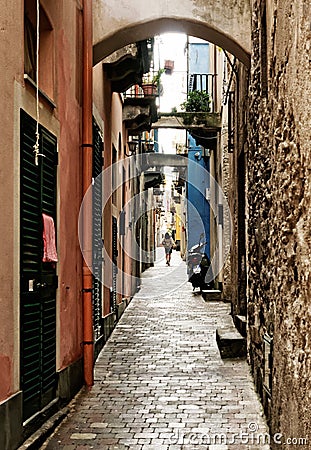 Single person in a long mediterranean alley Stock Photo