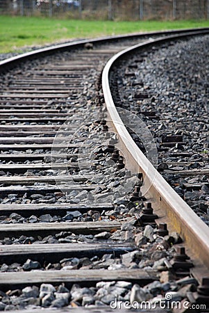 Single railway track which turns Stock Photo