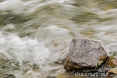 single rock in the brook Stock Photo