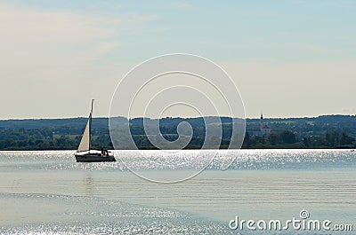 Single sailboat on a lake Editorial Stock Photo