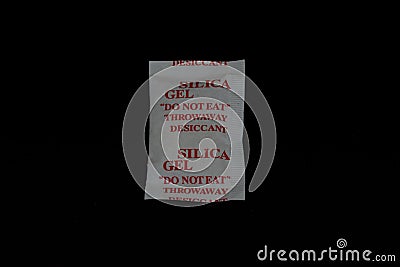 Single silica gel sachet or packet with red text Stock Photo