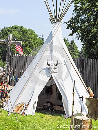 A single, solitary teepee in a field. Teepees are used in many summer camps as shelter for the campers. Editorial Stock Photo