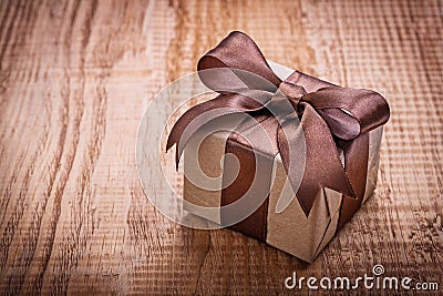 Single square vintage gift box qith brown bow on Stock Photo