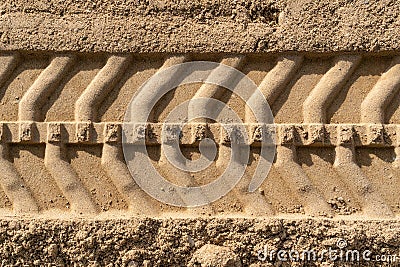 Single tire track on brown sand in construction site Stock Photo
