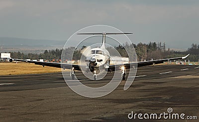 Single turboprop aircraft, airplane taking off Stock Photo