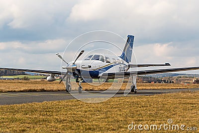 Single turboprop aircraft on airport Pribram, 28th February 2014. Editorial Stock Photo