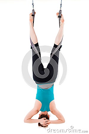 Single upside down woman doing aerial yogawith a hammock Stock Photo