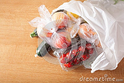 Single use plastic waste issue. fruits and vegetables in plastic bags Stock Photo