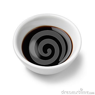 Single white bowl with Balsamic vinegar, aceto balsamico, on white background close up Stock Photo