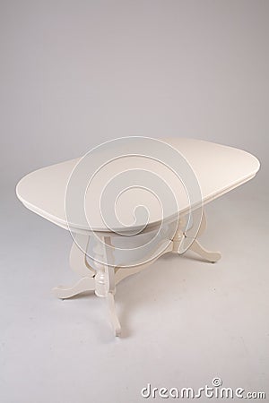 Single white round table with empty surface and carved legs on an isolated Stock Photo