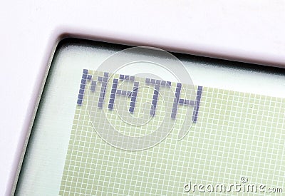 A single word MATH on a graphing calculator digital display, object macro, detail, extreme closeup, nobody. Mathematics, computer Stock Photo