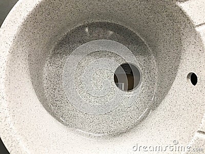 Sink without faucet and drainage pipes. concrete sink with holes for water supply and drainage. sink for home, goods in a hardware Stock Photo