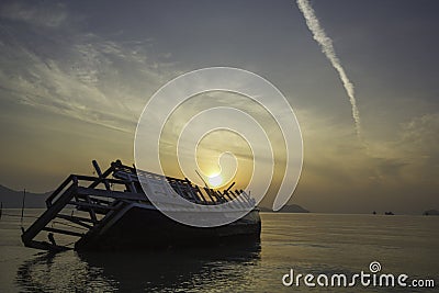Sinking boat in the sea Stock Photo