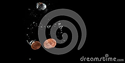 Sinking Euro. Splash of coins falling into the water. Coins in the water. Splash of coins falling into the water Stock Photo
