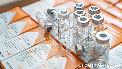 Sinovac vaccine, Coronavac vaccination for covid-19 coronavirus protection in bottle with chinese label Editorial Stock Photo