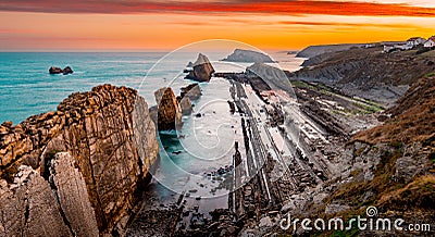 Sinrise in a magic place Arnia coast.Santander Stock Photo