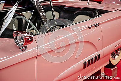 SINSHEIM, GERMANY - OCTOBER 16, 2018: Technik Museum. Historical car. Side view of the rare pink cabriolet. Beautiful Editorial Stock Photo