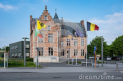 Sint-Gillis-Waas, East Flemish Region, Belgium - Town hall and square with local, Flemish and Belgian flags Editorial Stock Photo