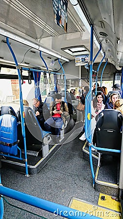 Interior view of a Sintra bus going to various attractions, tourists waiting for the bus to start, and passengers Editorial Stock Photo