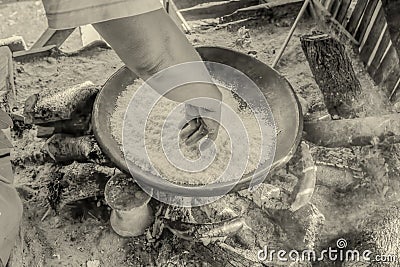 Siona Woman Cooking Cassava In Traditional Kitchen Stock Photo