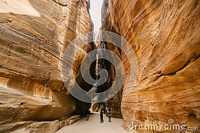 Siq, the narrow slot-canyon that serves as the entrance passage to the city of Petra, Jordan Editorial Stock Photo