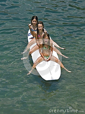 Sirens - surfing children Stock Photo