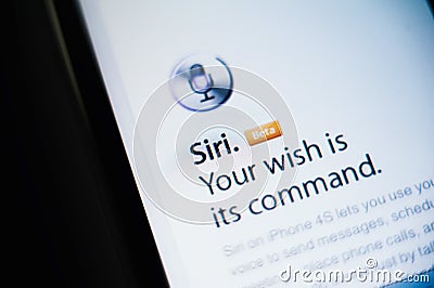 Siri voice command on Apple smartphone and tablet Editorial Stock Photo