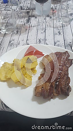Sirloin steak with baker potatoes Stock Photo