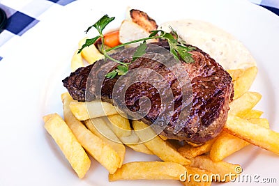 Sirloin strip Steak -entrecote- with vegetables an Stock Photo