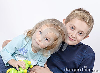 Sister and brother children portrait on white background. Stock Photo