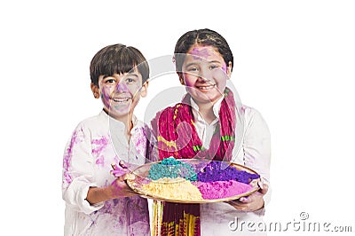 Sister and brother holding color plate Stock Photo