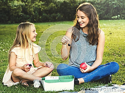 Sister Girls Talk Picnic Togetherness Outdoors Concept Stock Photo