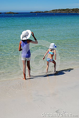 Sisters on beach Stock Photo