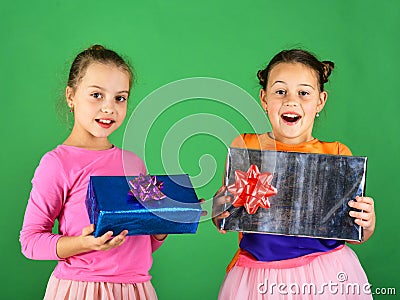 Sisters with gift boxes for holiday. Children with happy faces Stock Photo