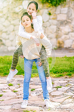 Sisters having fun outdoor. Stock Photo