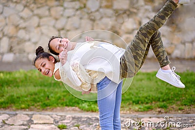 Sisters having fun outdoor. Stock Photo