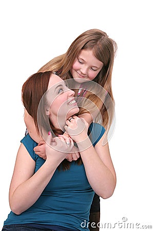Sisters hugging Stock Photo