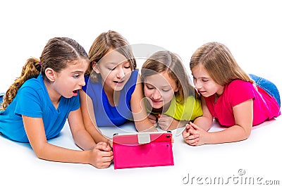 Sisters kid girls with tech tablet pc playing happy Stock Photo