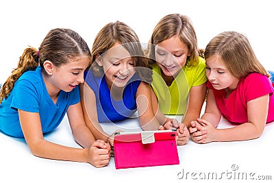 Sisters kid girls with tech tablet pc playing happy Stock Photo