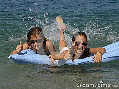 Sisters thumbs up Stock Photo