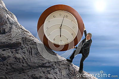 Sisyphus stressed for time man rolling huge clock up hill Stock Photo