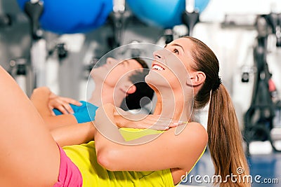 Sit-ups in gym for fitness Stock Photo