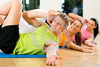 Sit-ups in gym for fitness Stock Photo