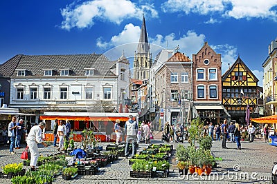 Sittard, Netherlands - March 25. 2022: View on traditional local farmer market square in ancient town, colorful old buildings on s Editorial Stock Photo