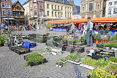 Sittard, Netherlands - March 25. 2022: View on traditional local farmer market square in ancient town, colorful old buildings on s Editorial Stock Photo