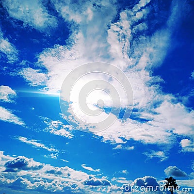 Sitting on the airplane that was flying and looking out at windows see beautiful skyline, clouds and land. Feeling freedom. Stock Photo