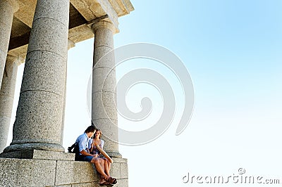 Sitting couple tourists ruins Stock Photo