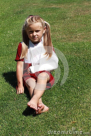 Sitting girl with broken hand Stock Photo