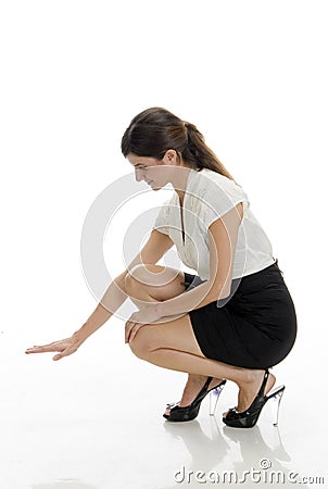 Sitting lady looking down side Stock Photo