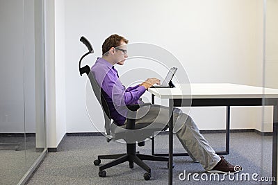 Sitting posture at tablet Stock Photo